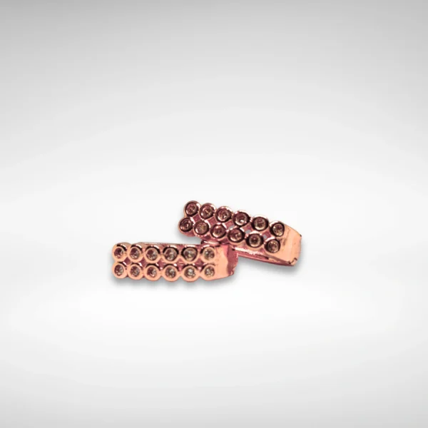 "Elegant rose gold spiral loop earrings displayed in a black velvet box with floral gift packaging"