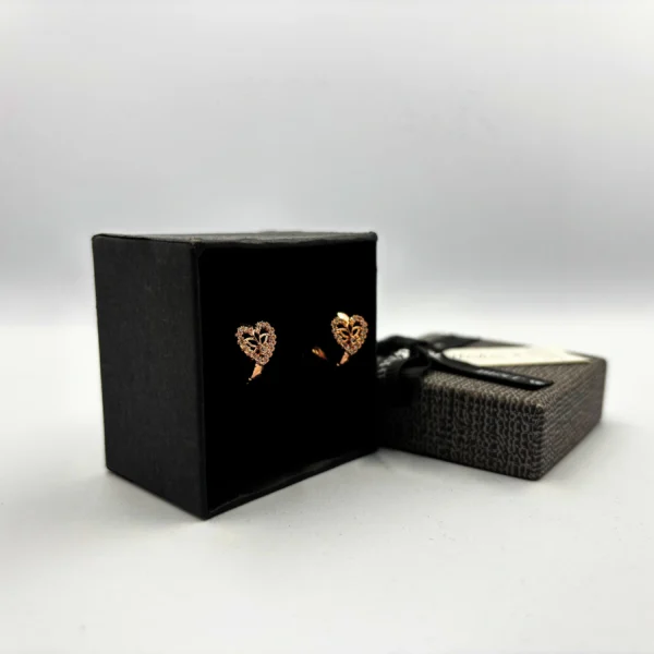 "Heart-shaped gold finish clip-on earrings with CZ stones"