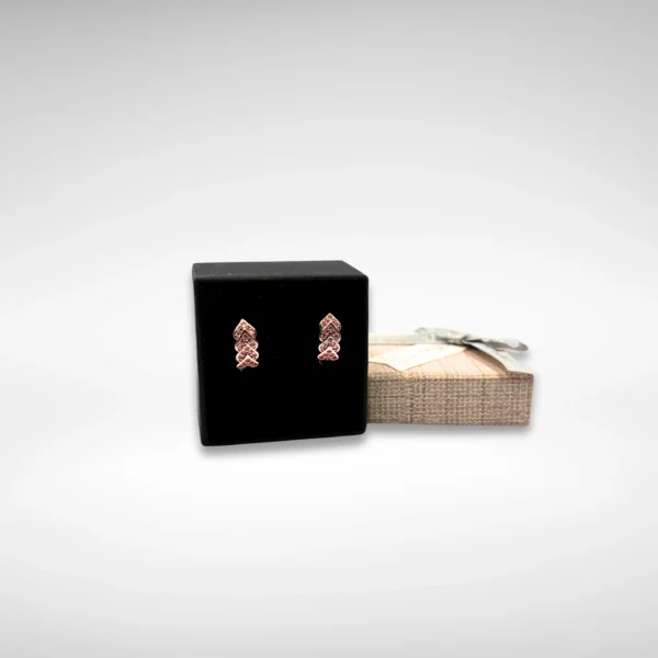 Gold-plated leaf pattern earrings with American diamond stones