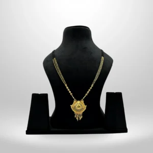 Gold-plated bridal mangalsutra with intricate pendant on black beaded chain displayed on black stand